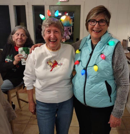 Three women in holiday attire.